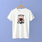 White t-shirt with coffee-themed graphic and text on a hanger against a purple background