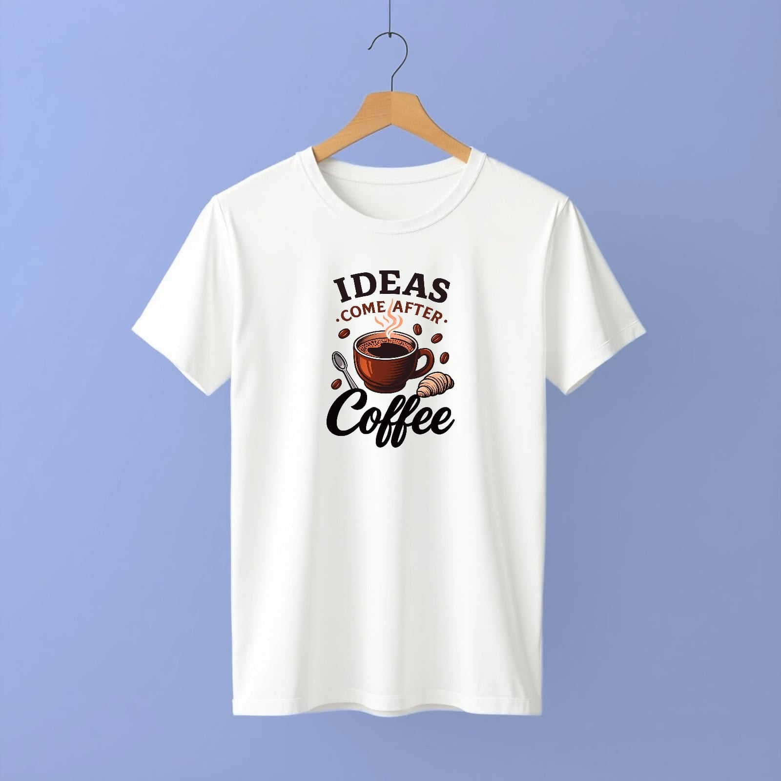 White t-shirt with coffee-themed graphic and text on a hanger against a purple background